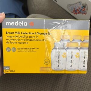 Medela Yellow and White Milk Storage Bottles